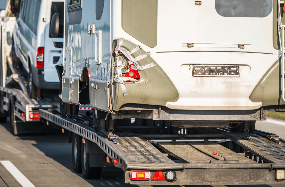 rv after wreck being towed away