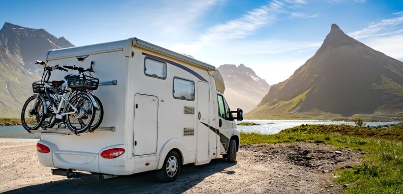 used camper parked next to a mountain how to buy it