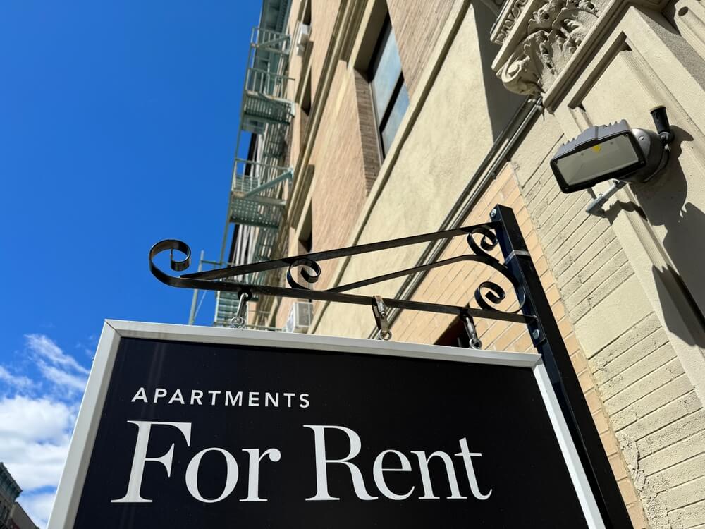 A for rent sign on an apartment building - best insurance for landlords.