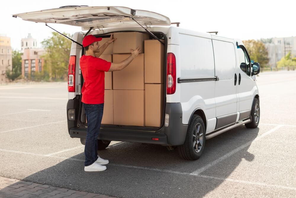 Employee loads up delivery van - best commercial auto insurance.