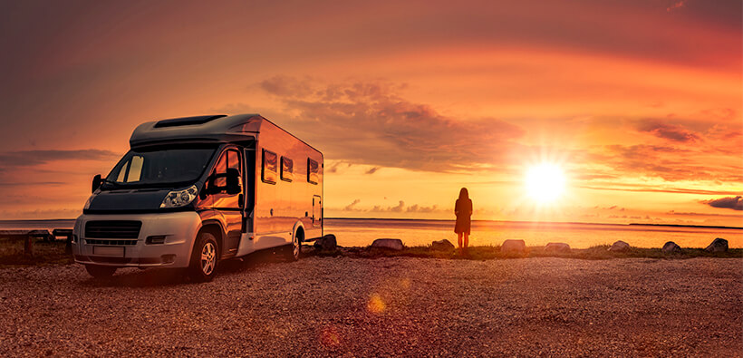 RV parked in a sunset