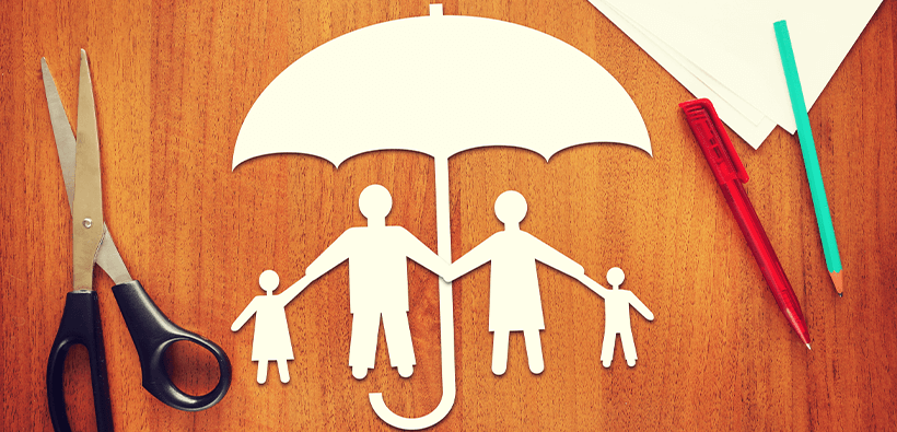 An umbrella and family crafts on the table