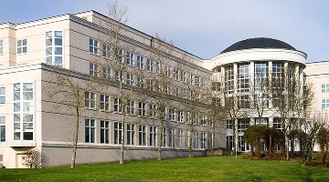 Kent, WA, USA - January 21, 2021; Norm Maleng Regional Justice Center building in the King County city of Kent Washington shown in a wide view.