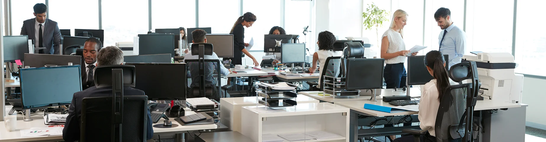 Interior Of Busy Modern Open Plan Office With Staff – best business insurance.