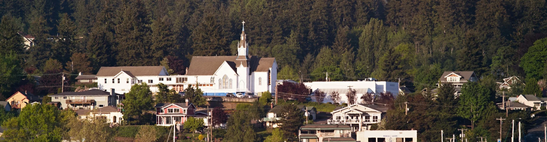 Old church stand above the quaint town of Poulsbo in Washington State – Home insurance in Washington